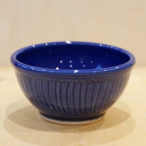 Small blue bowl with sgraffito decoration